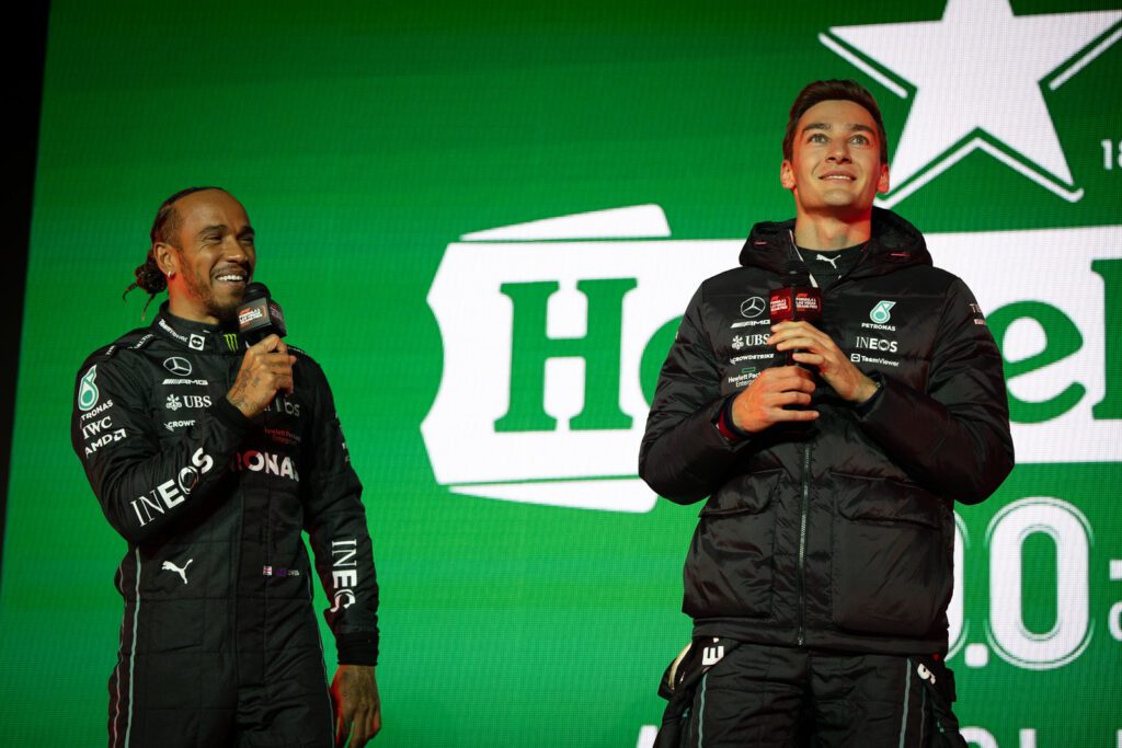 Lewis Hamilton and George Russell of Great Britain and Mercedes talk on stage during the Formula 1 Las Vegas Grand Prix 2023 launch party on November 05, 2022 on the Las Vegas Strip in Las Vegas, Nevada.