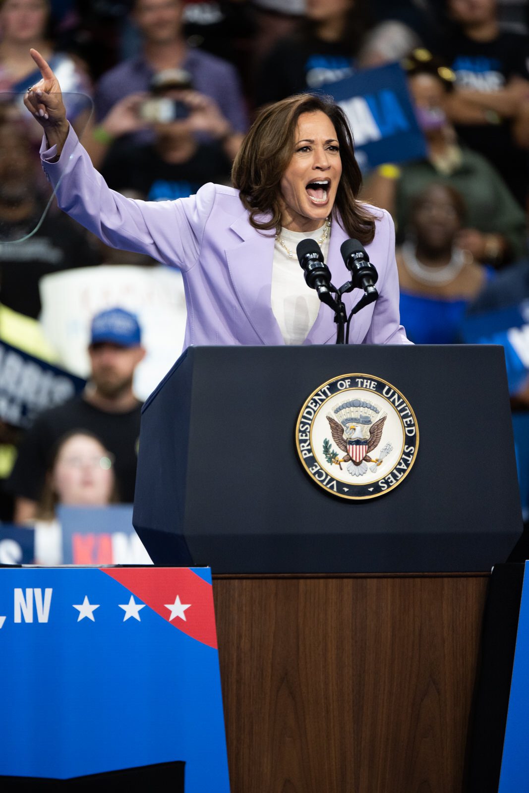 Vice President Kamala Harris speaks passionately at a rally for her presidential campaign at a podium in Las Vegas Nevada.