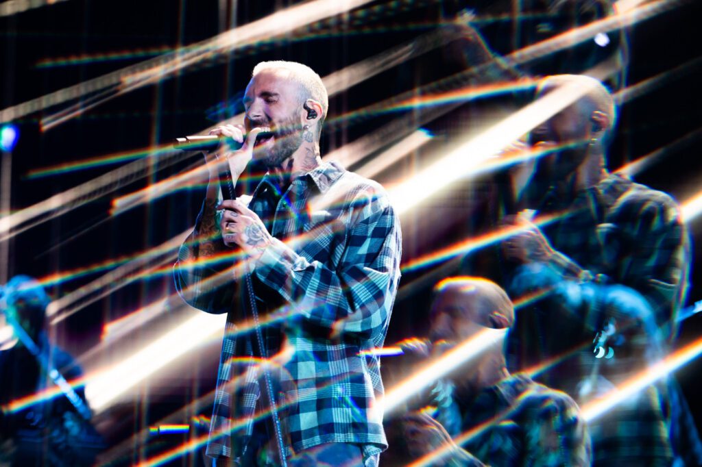 Adam Levine singing during Maroon 5 set at the iHeartRadio Music Festival 2025 in Las Vegas