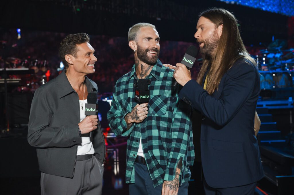 Ryan Seacrest interviewing Adam Levine and James Valentine backstage at the iHeartRadio Music Festival 2025 in Las Vegas
