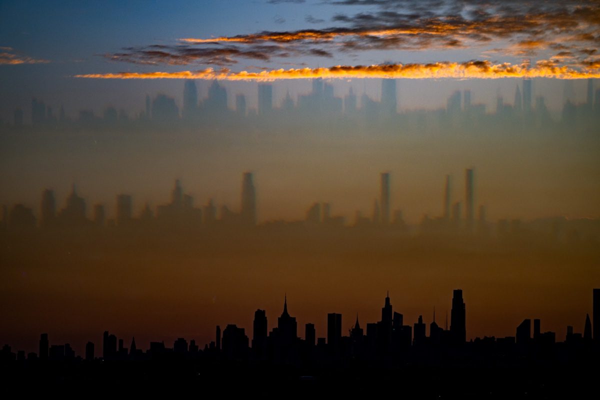 Dramatic double exposure of NYC skyline layered with clouds during the 2025 US Open.