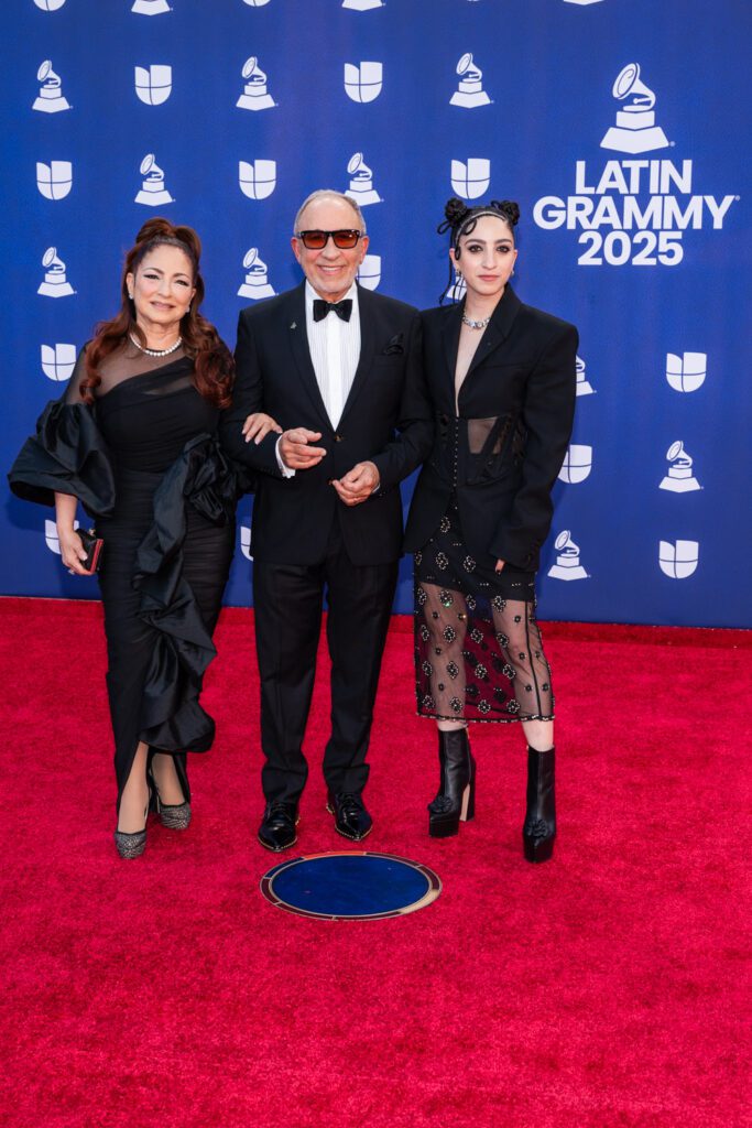 Gloria, Emilio, and daughter Emily Estefan arrive together and pose on the Latin Grammy red carpet wearing coordinated black outfits.