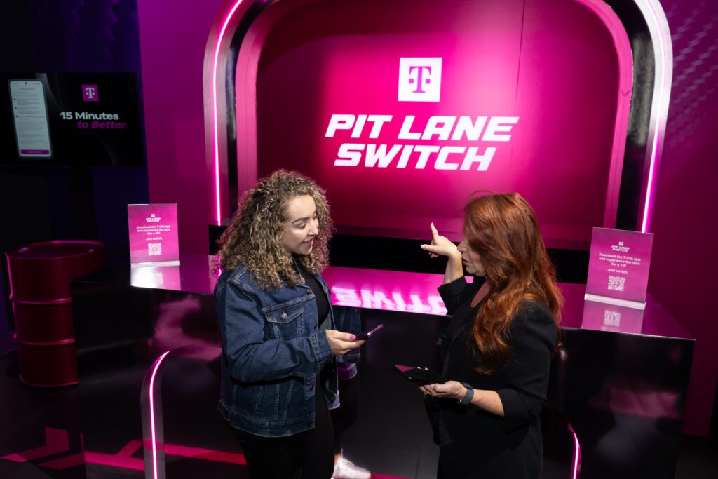 Guests interacting at the Pit Lane Switch activation during T-Mobile’s Switching Made Easy event.