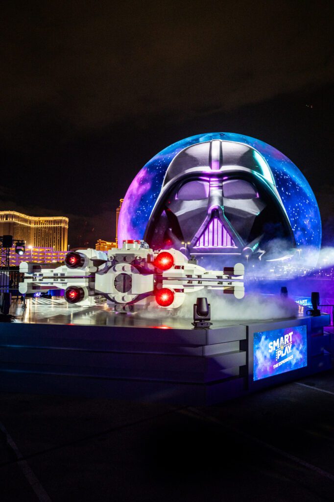 LEGO Star Wars X-wing installation at Sphere Las Vegas with Darth Vader imagery on the Exosphere during the SMART Play experience