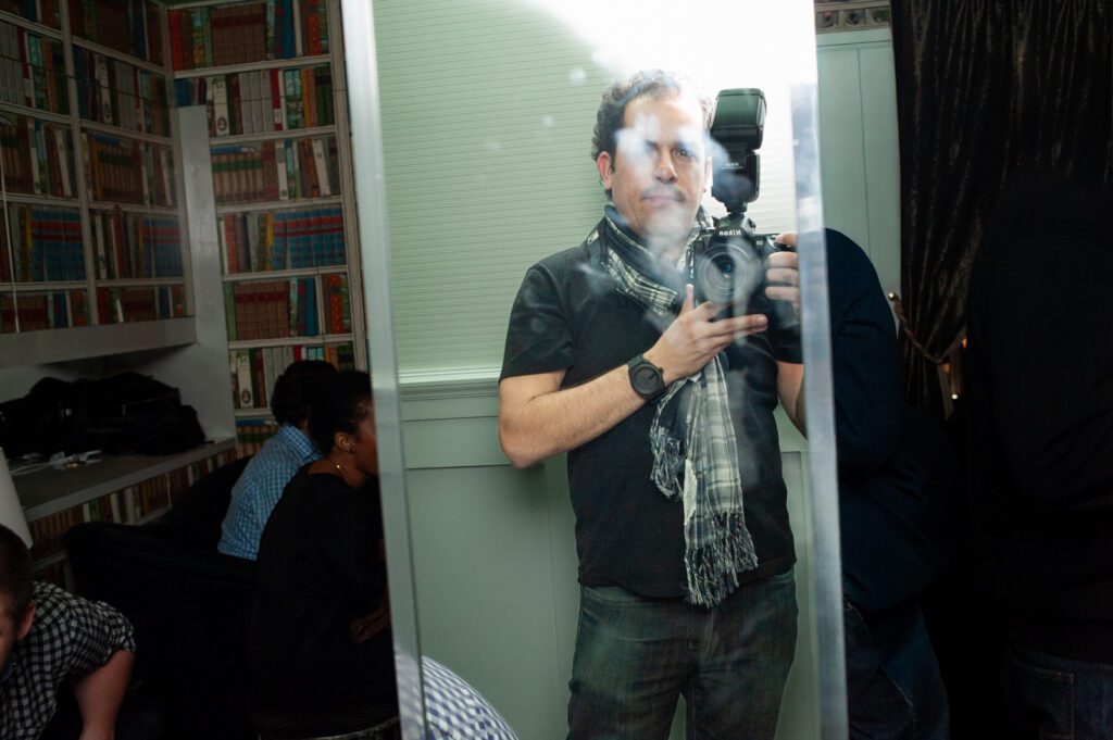 Reflection portrait of photographer during Bill Burr after party at Carnegie Hall