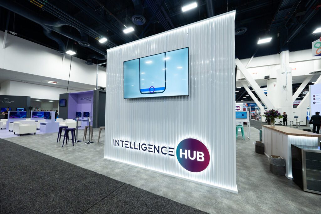 Intelligence Hub exterior signage at the Pinewood.AI booth at NADA 2026 at the Las Vegas Convention Center